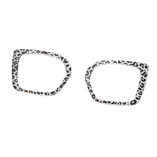 Two leopard print eyeglass frames on a white background