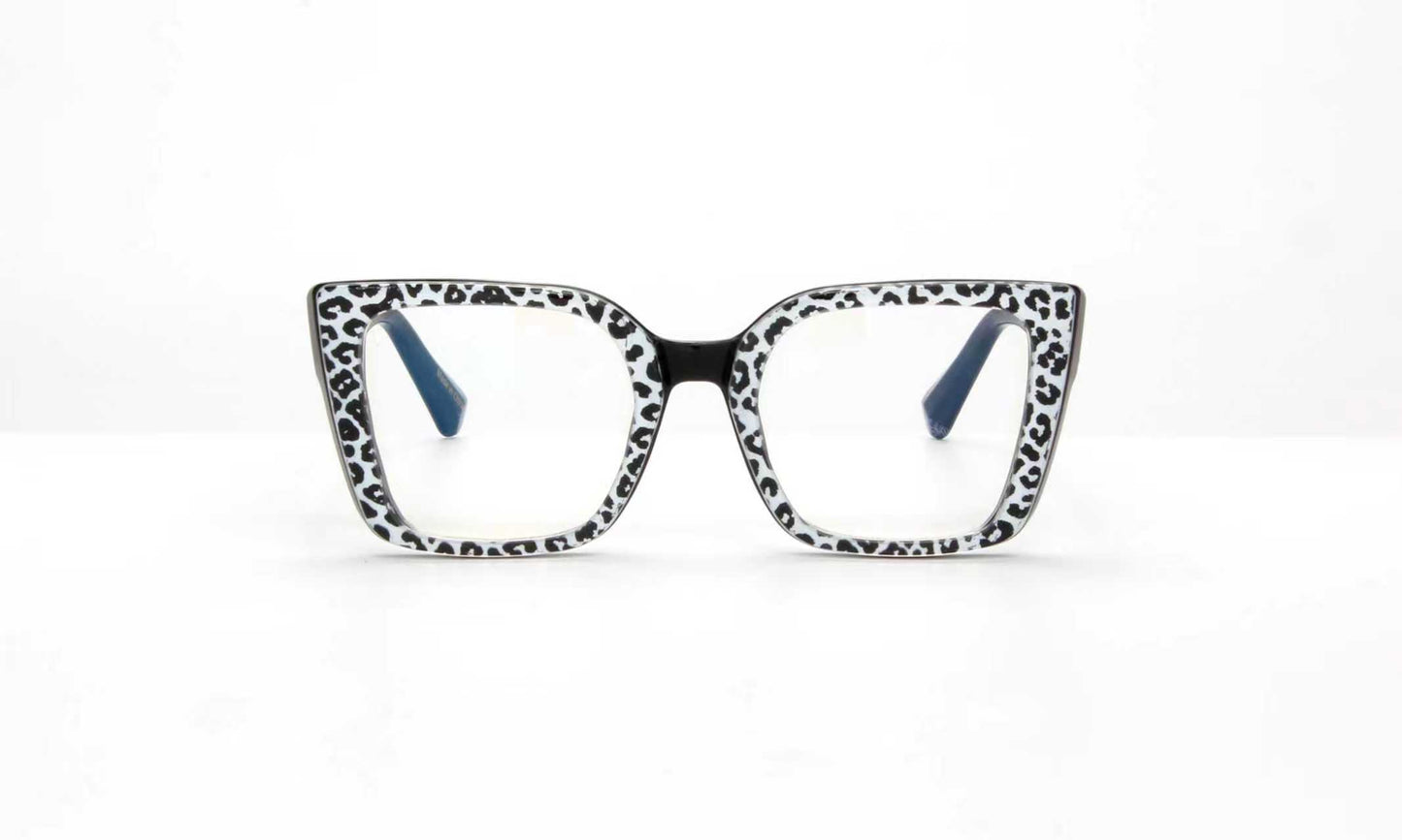 Cat-eye glasses with a black and white pattern on a white background