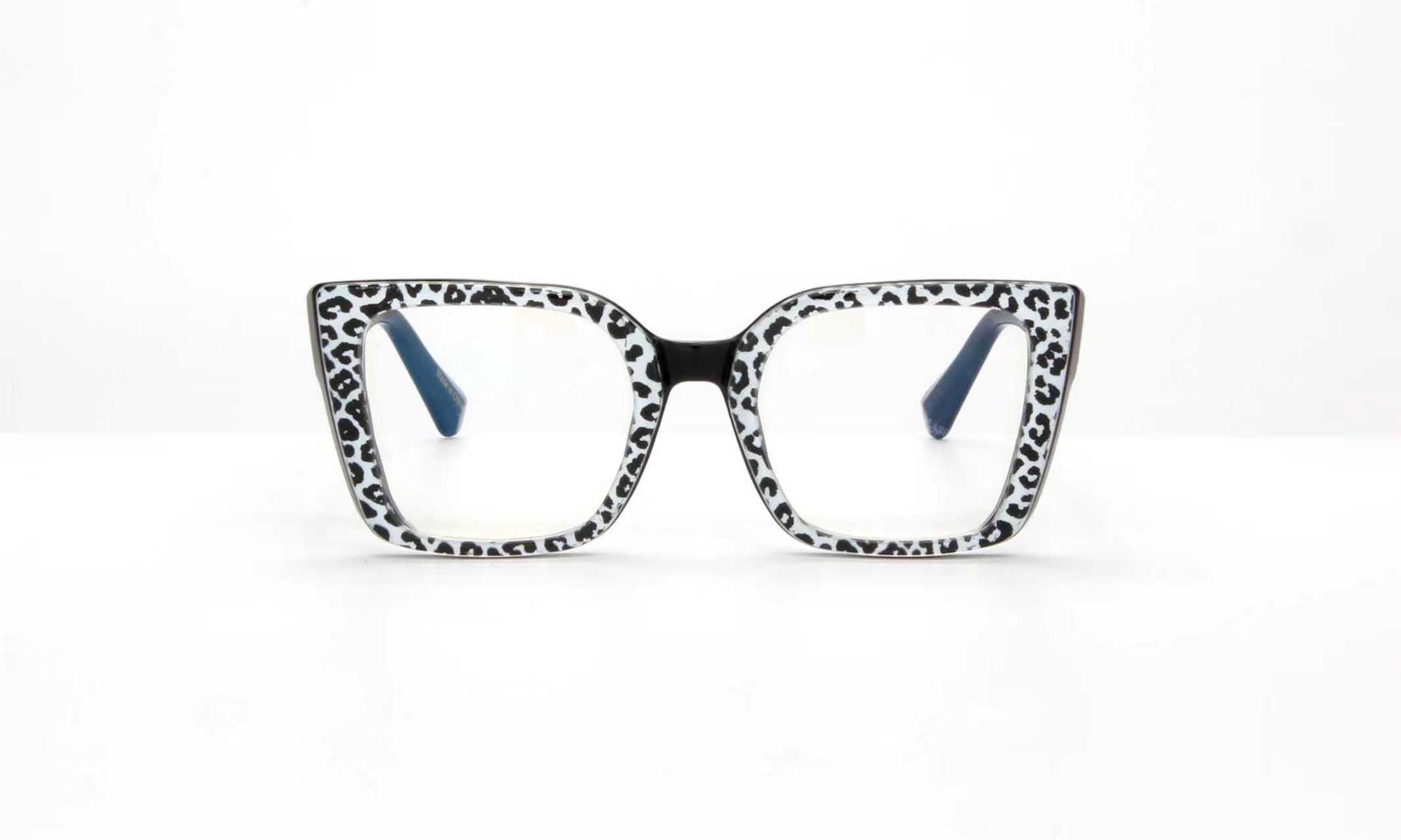 Cat-eye glasses with a black and white pattern on a white background