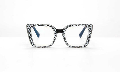 Cat-eye glasses with a black and white pattern on a white background