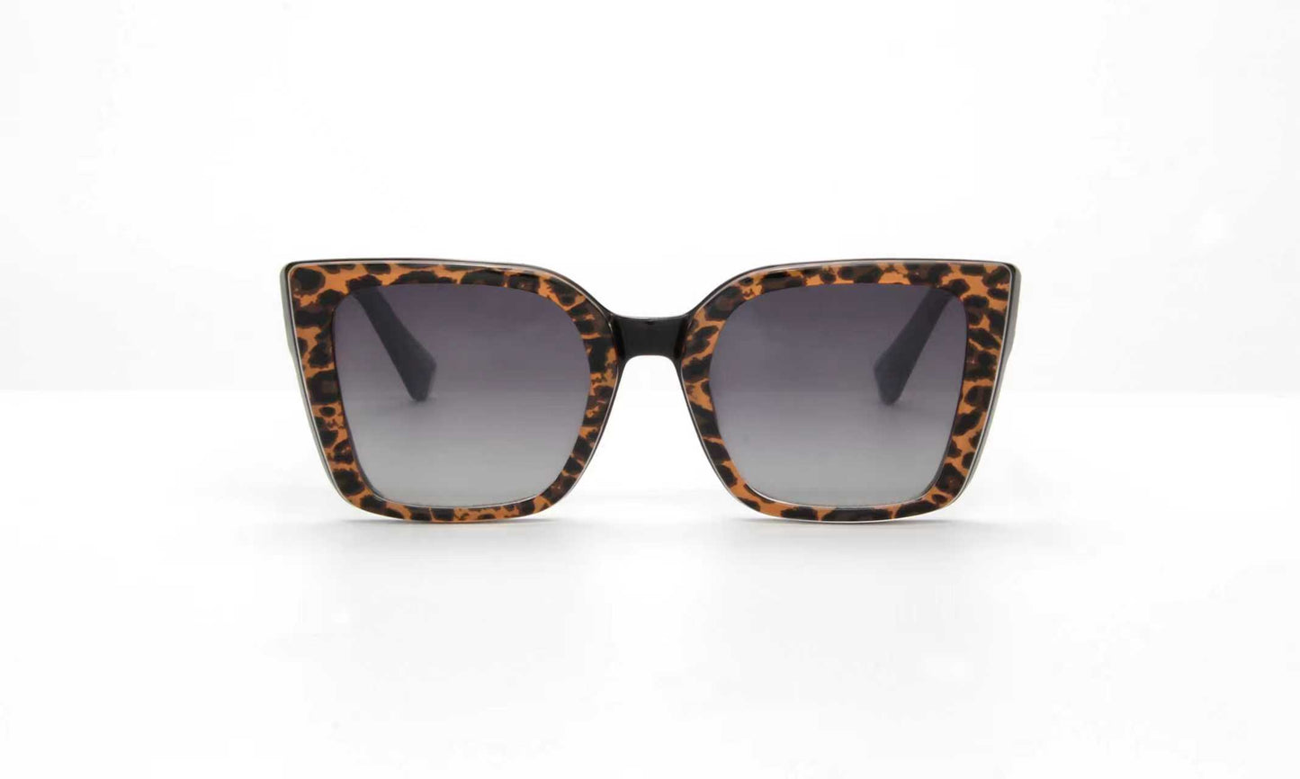 Sunglasses with leopard print frame on a white background