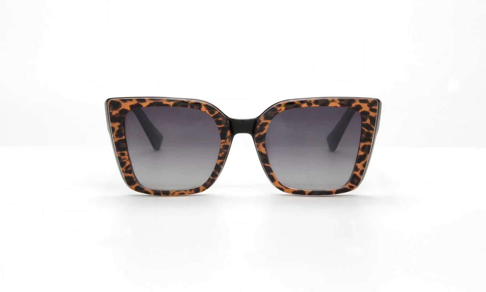 Sunglasses with leopard print frame on a white background