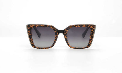Sunglasses with leopard print frame on a white background