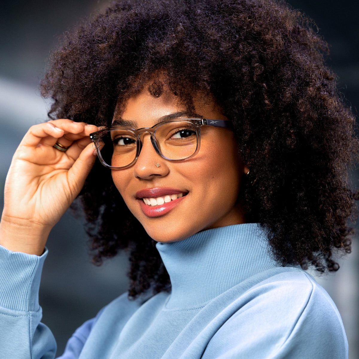 Woman using Reebok Thunder smart glasses